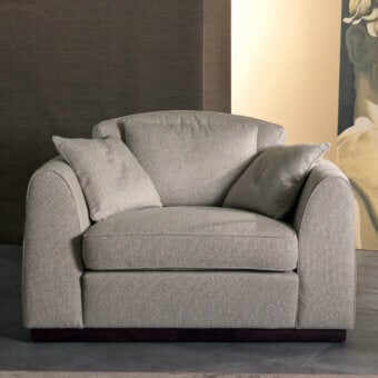 Superior Zanaboni Santiago lounge chair built with light gray textured textile and mocha-stained wooden base