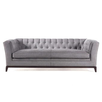 Distinguished Zanaboni Stark sofa upholstered in medium gray textile with a capitonné backrest and dark-toned wood base