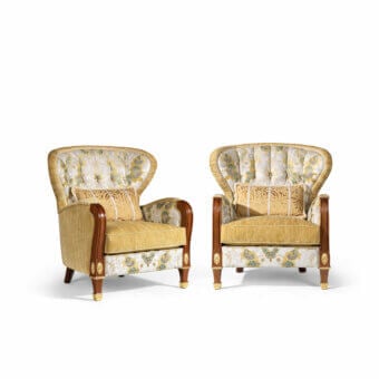 Distinguished Armando Rho A1266 lounge chair with yellow, beige, and blue floral textile and gold leaf mahogany frame