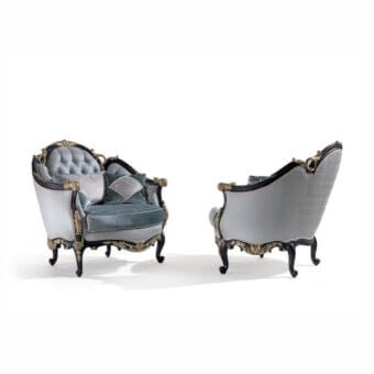 Distinguished Armando Rho A1384 lounge chair with light blue quilted upholstery and black distressed wood frame with antique silver leaf