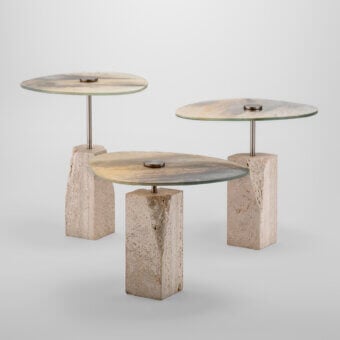 Distinguished Arte Veneziana Rascino side table with extra-clear baked glass displaying a mixed Fondale finish and refined travertine marble base