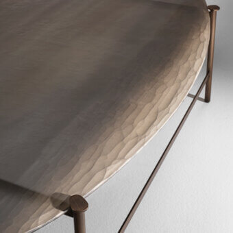 Elegant Arte Veneziana Soana coffee table with a textured glass top and slender burnished brass frame