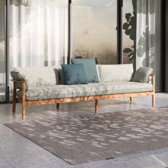 Sophisticated Atmosphera Panama sofa with subtly patterned muted gray textile and refined linear teak frame