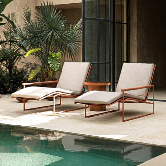 Superior Atmosphera Pipe chaise lounge with reddish-brown epoxy coated tubular steel and solid teak armrests crafted in breathable beige textilene