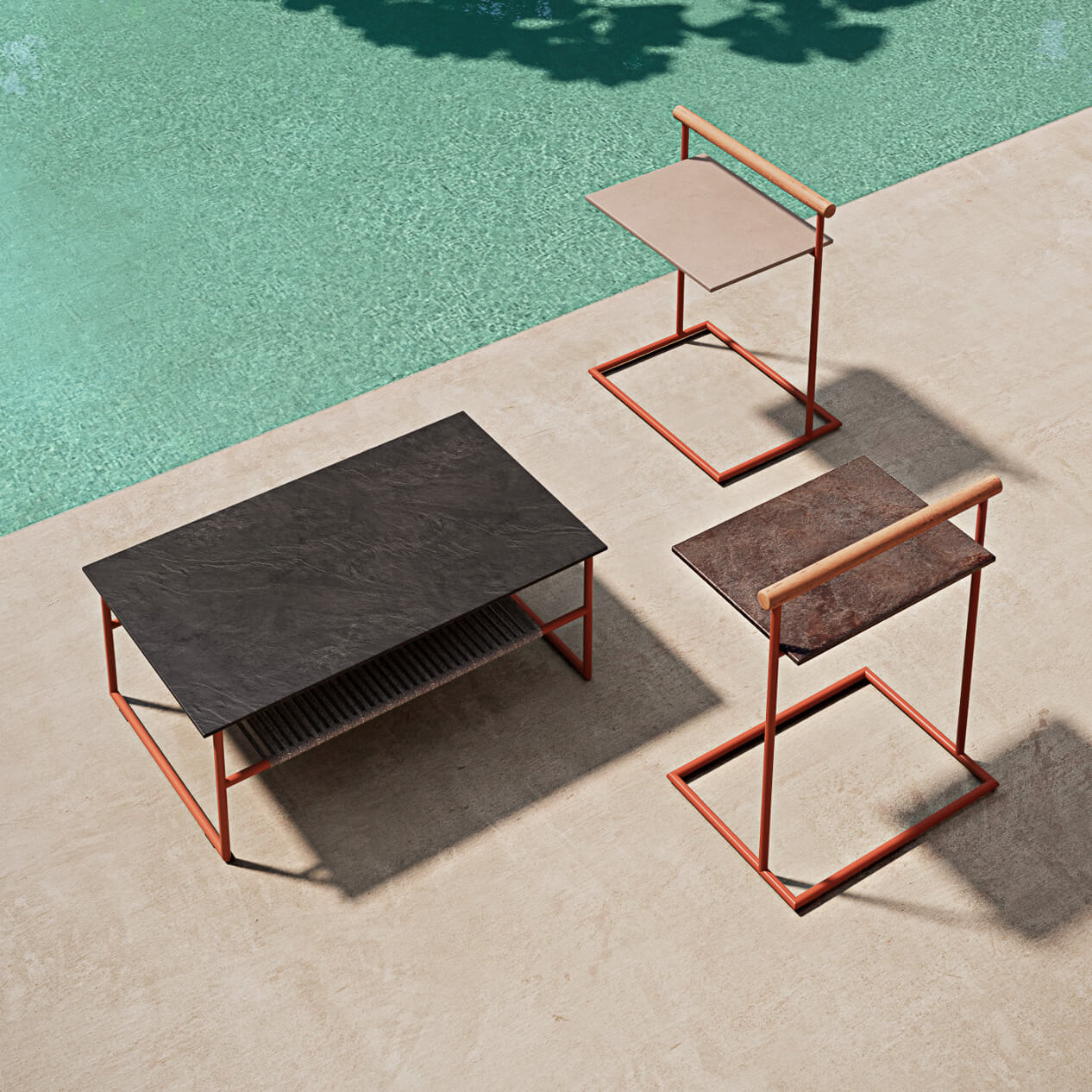 Elegant Atmosphera Pipe coffee table with dark grey gres top and reddish-brown epoxy powder-coated steel frame crafted with woven grey rope