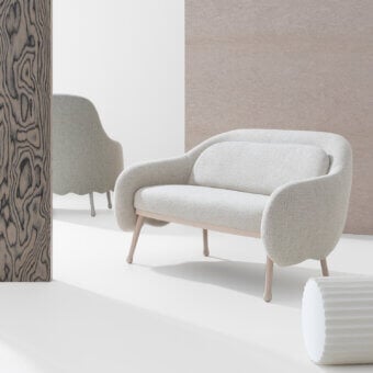 Elegant Billiani Corolla sofa crafted in light beige textured textile with satin finished wooden legs