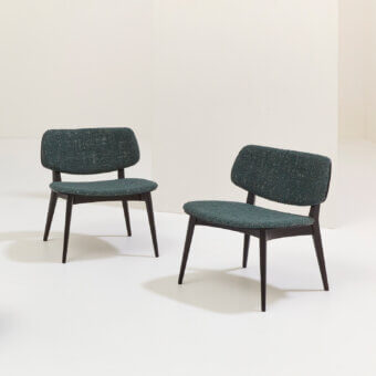 Distinguished Billiani Doll lounge chair crafted in Italy with dark teal textured textile and slender wood legs with matte finish
