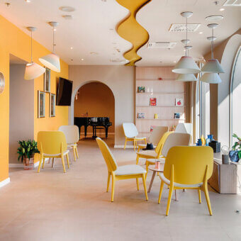 Superior Billiani Doll lounge chair with gently curved form and vibrant yellow molded synthetic material with smooth matte finish