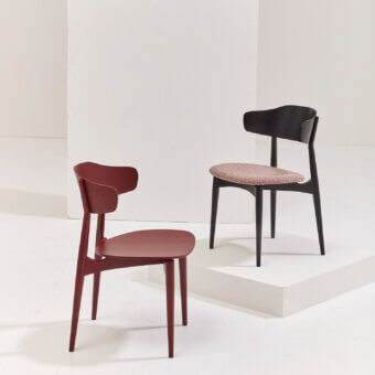 Distinguished Billiani Flow dining chair with reddish-brown wood and a sleek satin finish offering a curved backrest