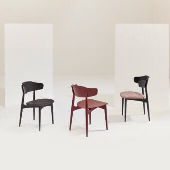 Sophisticated Billiani Flow dining chair with dark-toned wood and black textile, exhibiting clean lines with a gently curved backrest