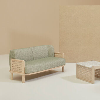 Elegant Billiani Raquette sofa crafted in Italy with patterned green and off-white textile and light-toned wood frame