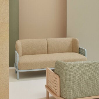 Distinctive Billiani Raquette sofa crafted in Italy with woven light tan fabric and muted blue-grey metal legs
