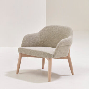 Lavish Billiani Spy Lounge chair with gently curved fully upholstered form and smooth light-toned wooden base crafted in Italy