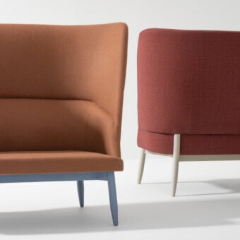 Distinguished Billiani Spy sofa with inviting form and reddish-brown textured textile upholstery plus light wood satin finish legs