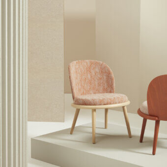 Sophisticated Billiani Veretta lounge chair with curved solid beechwood framing and textured orange-cream patterned upholstery in satin finish