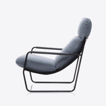 Distinguished Black Tie Clizia lounge chair with muted gray-blue textile upholstery and matte black metal frame crafted in Italy
