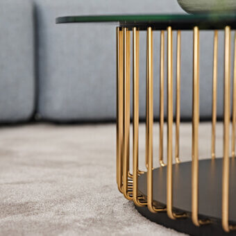 Distinguished Black Tie Etan coffee table with glossy golden metal and dark back-lacquered glass tabletop crafted in a refined round silhouette