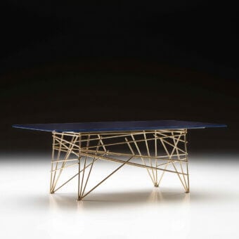 Distinguished Black Tie coffee table with back-lacquered glass top and intricately woven golden metal base