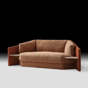 Exceptional Black Tie Lilith sofa with reddish-brown wood frame and plush textured bouclé cushions offering integrated side shelves