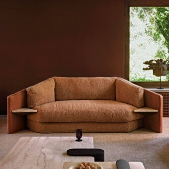 Superior Black Tie Lilith sofa with earthy brown bouclé textile and smooth satin-like brown wood frame