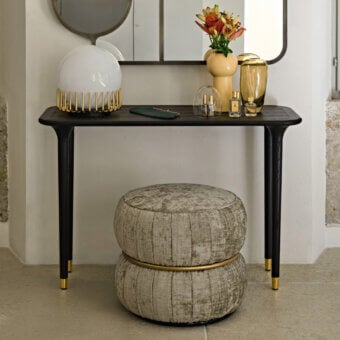Distinguished Black Tie Livia console crafted in dark-toned wood with satin finish and delicate golden metal feet