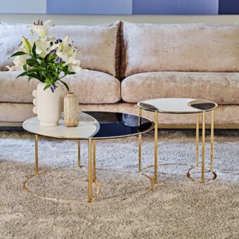 Distinctive Black Tie Nilo coffee table with laser-cut metal structure, polished gold finish, and back-lacquered glass mirror surfaces