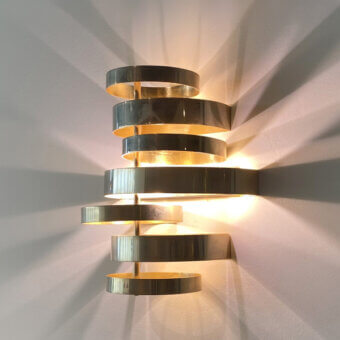 Elegant Black Tie Olly wall lamp crafted in stainless steel with a muted silver-gray finish and subtle golden undertones