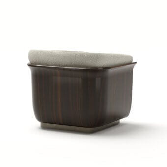 Refined Capital Allure lounge chair with plush neutral gray upholstery and a meticulously carved wooden frame with satin finish