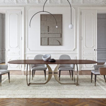 Distinguished Capital Convivio table crafted with a satin finish wood tabletop and muted gold curved metal base
