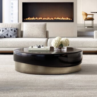 Distinguished Capital Merian coffee table crafted with a metallic base and fluid lacquered surface in a deep glossy tone