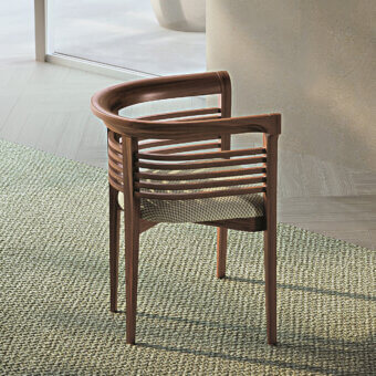 Exceptional Carpanelli Dolfin chair crafted from solid ash wood with woven textile and medium-dark brown finish