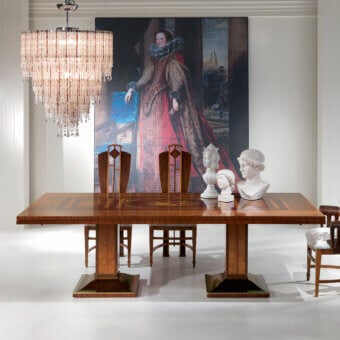 Elegant Carpanelli Le Luci Della Ribalta extendable table with warm brown wood and delicate ecological motifs crafted in a glossy finish
