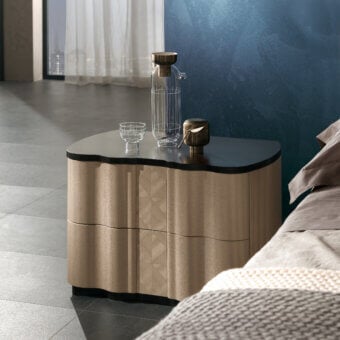Elegant Carpanelli Mistral nightstand with warm beige wood and contrasting black tabletop crafted with a subtly textured finish