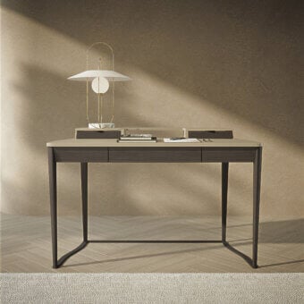 Refined Carpanelli Pegaso desk crafted with fine walnut wood and a curved metal base in a grayish-brown finish