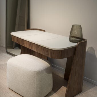 Distinguished Carpanelli Shape vanity with a refined wooden structure and luxurious leather top in a medium-dark brown finish