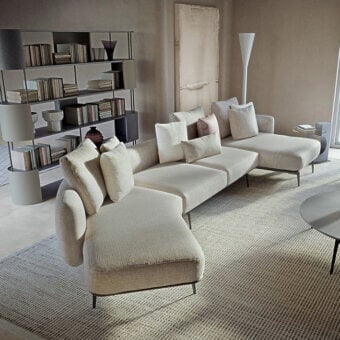 Exceptional Carpanelli Sirio sectional with textured neutral beige textile and finely stitched leather accents on a metal base