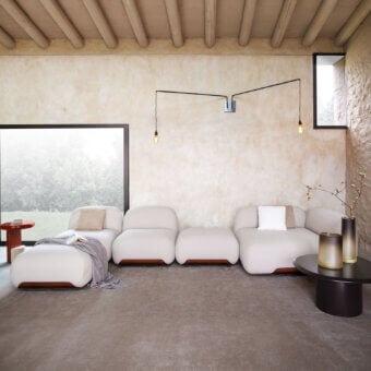 Exceptional Carpanese Home Bubble Sectional sofa upholstered in smooth beige textile with a warm-toned wood base