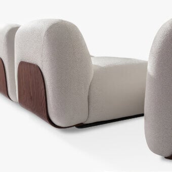 Distinguished Carpanese Home Bubble Sectional sofa upholstered in light neutral textile with a dark brown satin-finish curved wood base