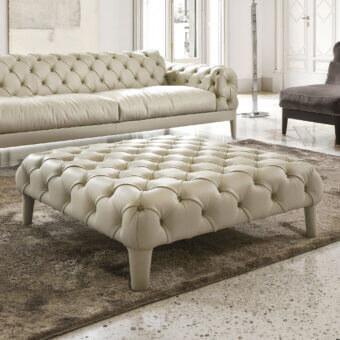 Handcrafted CTS Salotti Elliot ottoman in light beige leather with capitonné detailing and a matte finish