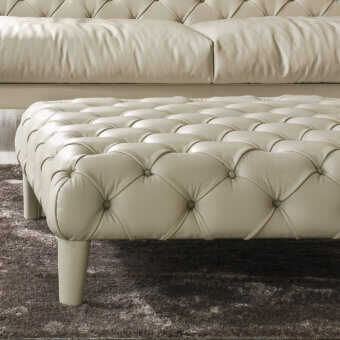 Distinguished CTS Salotti Elliot ottoman crafted in neutral beige with refined capitonné upholstery and cylindrical legs
