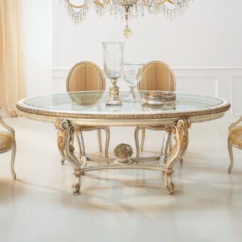 Distinguished Faber Mobili Ortensia table with intricately carved wood, gilded accents and a glossy glass top