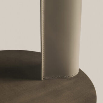Elegant Frag Bler side table crafted with steel and saddle leather, showcasing muted olive green with a brushed finish