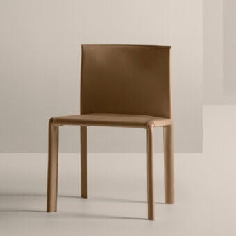 Superior Frag Blyn dining chair with full saddle leather upholstery and smooth, slightly textured tan finish