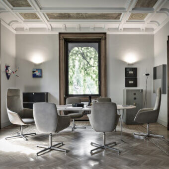 Distinguished Mea Office armchair in muted gray leather with polished metal elements and a five-spoke adjustable base