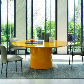 Distinguished Frag Myon dining table with a vibrant yellow glossy lacquered MDF top and cylindrical base achieving harmonious balance