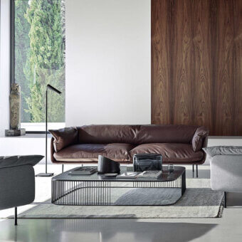 Superior Frag Winnie sofa upholstered in warm brown premium leather with gently curved arms and refined lines