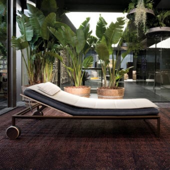 Superior Giorgetti Gea lounger with carob aluminum frame and dual-tone breathable textile cushioning for refined outdoor indulgence