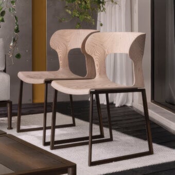 Distinguished Giorgetti Gea chair with a geometric stainless-steel frame powder-coated in carob and a birch plywood seat