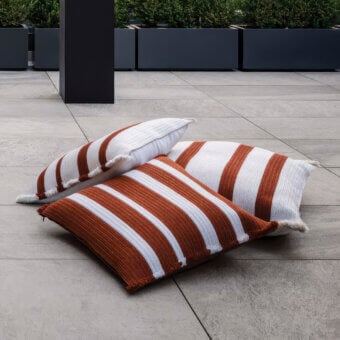 Exceptional Giorgetti Nisida cushion crafted with reddish-brown and crisp white polypropylene technical yarn braids with decorative fringe