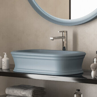 Elegant Norah Design ARBA 02 washbasin with sculpted form in muted blue-grey Norahcryl solid surface and velvety matte finish